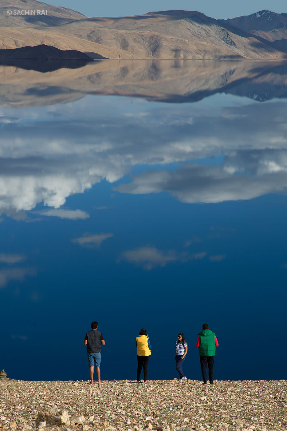 Tourists standing in front of the Tso Moriri Lake, Ladakh, India